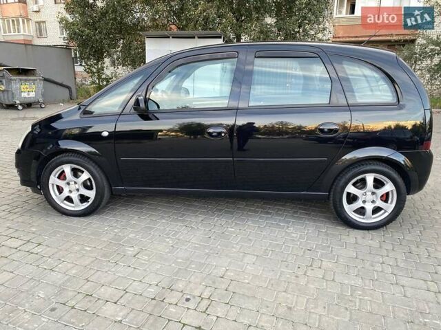 Черный Опель Мерива, объемом двигателя 1.8 л и пробегом 260 тыс. км за 5800 $, фото 3 на Automoto.ua