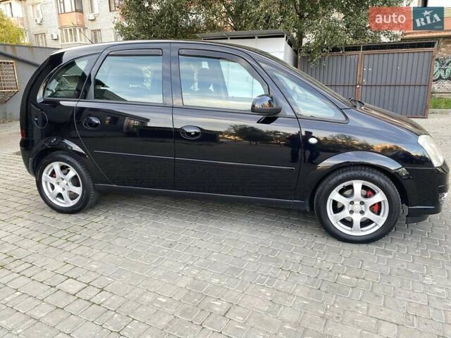 Черный Опель Мерива, объемом двигателя 1.8 л и пробегом 260 тыс. км за 5800 $, фото 11 на Automoto.ua