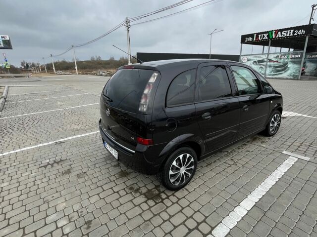 Черный Опель Мерива, объемом двигателя 1.8 л и пробегом 137 тыс. км за 4650 $, фото 2 на Automoto.ua