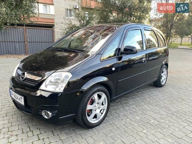 Черный Опель Мерива, объемом двигателя 1.8 л и пробегом 260 тыс. км за 5800 $, фото 1 на Automoto.ua