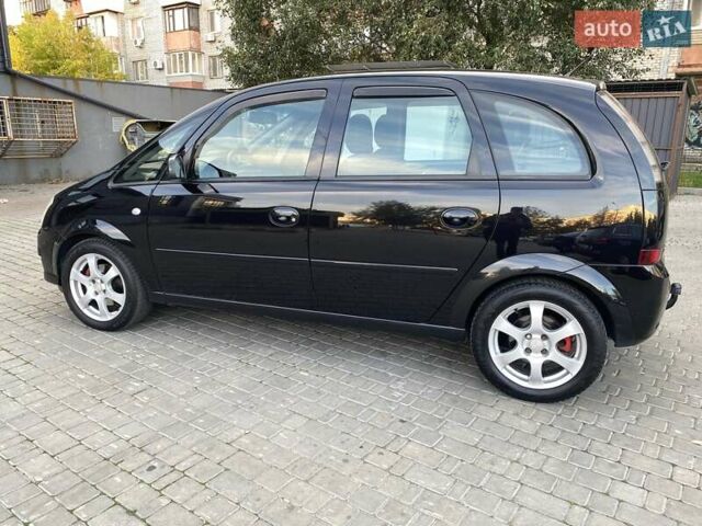 Черный Опель Мерива, объемом двигателя 1.8 л и пробегом 260 тыс. км за 5800 $, фото 4 на Automoto.ua