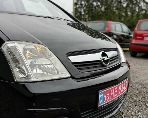 Черный Опель Мерива, объемом двигателя 1.6 л и пробегом 208 тыс. км за 4999 $, фото 59 на Automoto.ua