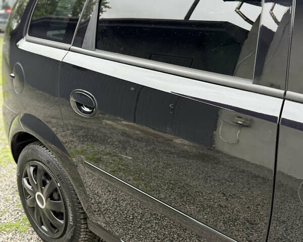 Черный Опель Мерива, объемом двигателя 1.6 л и пробегом 208 тыс. км за 4999 $, фото 61 на Automoto.ua