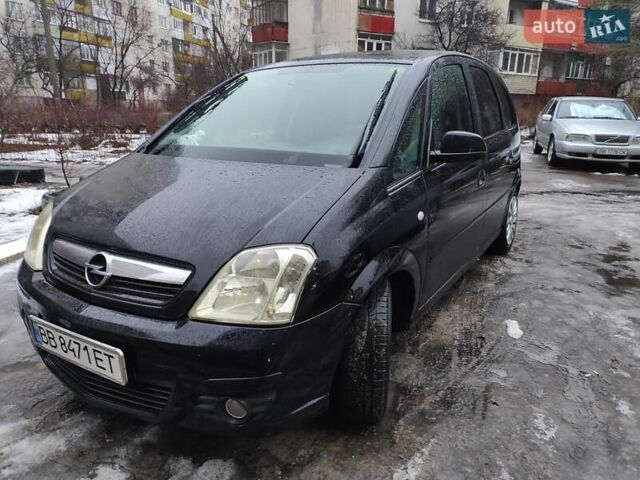 Черный Опель Мерива, объемом двигателя 1.4 л и пробегом 205 тыс. км за 5500 $, фото 11 на Automoto.ua
