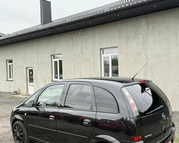 Черный Опель Мерива, объемом двигателя 1.6 л и пробегом 208 тыс. км за 4999 $, фото 5 на Automoto.ua