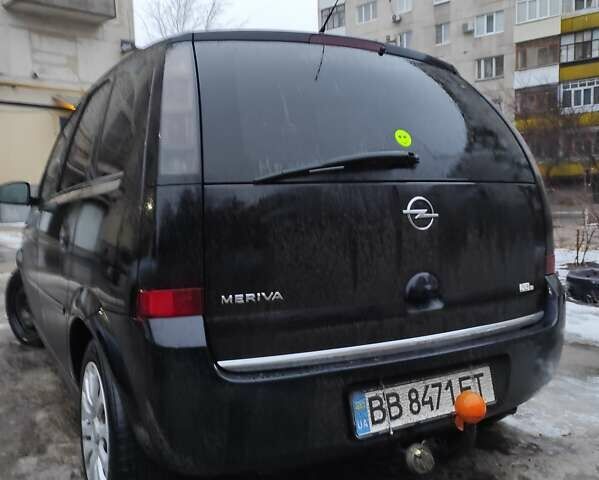 Черный Опель Мерива, объемом двигателя 1.4 л и пробегом 205 тыс. км за 5500 $, фото 3 на Automoto.ua