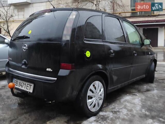 Черный Опель Мерива, объемом двигателя 1.4 л и пробегом 205 тыс. км за 5500 $, фото 7 на Automoto.ua