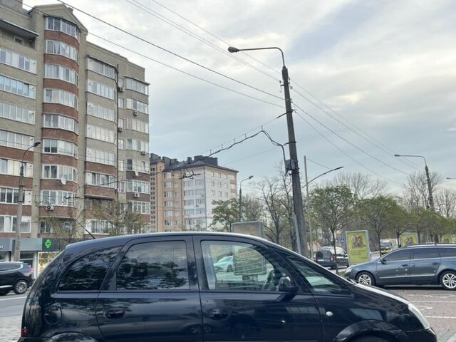 Черный Опель Мерива, объемом двигателя 1.6 л и пробегом 250 тыс. км за 4199 $, фото 4 на Automoto.ua