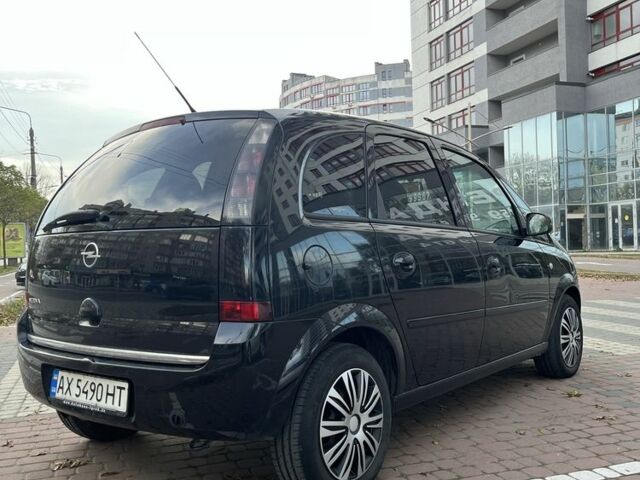 Черный Опель Мерива, объемом двигателя 1.6 л и пробегом 250 тыс. км за 4199 $, фото 6 на Automoto.ua