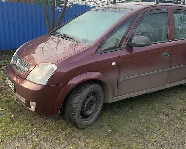 Красный Опель Мерива, объемом двигателя 1.7 л и пробегом 218 тыс. км за 3300 $, фото 2 на Automoto.ua