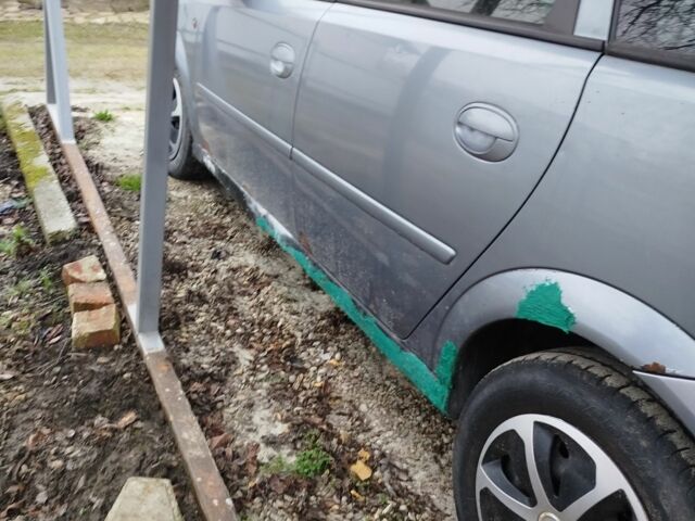 Серый Опель Мерива, объемом двигателя 1.7 л и пробегом 343 тыс. км за 1900 $, фото 6 на Automoto.ua