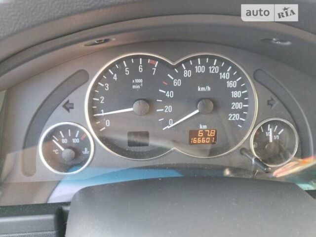 Серый Опель Мерива, объемом двигателя 1.6 л и пробегом 166 тыс. км за 4900 $, фото 5 на Automoto.ua