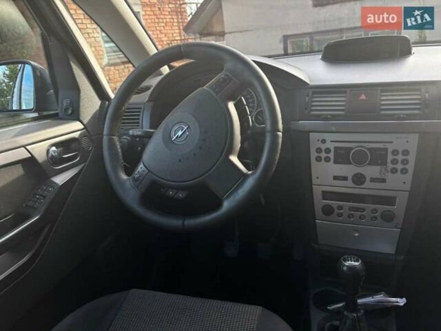 Синий Опель Мерива, объемом двигателя 1.69 л и пробегом 253 тыс. км за 3850 $, фото 17 на Automoto.ua