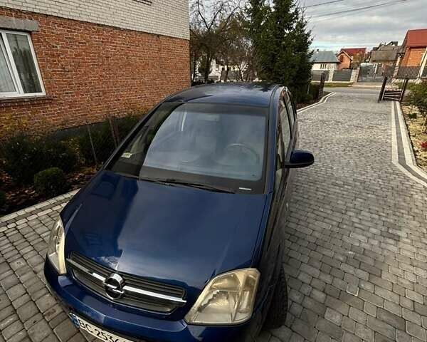Синий Опель Мерива, объемом двигателя 1.69 л и пробегом 253 тыс. км за 3850 $, фото 1 на Automoto.ua