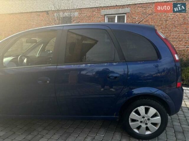 Синий Опель Мерива, объемом двигателя 1.69 л и пробегом 253 тыс. км за 3850 $, фото 6 на Automoto.ua