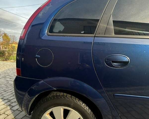 Синий Опель Мерива, объемом двигателя 1.69 л и пробегом 253 тыс. км за 3850 $, фото 4 на Automoto.ua