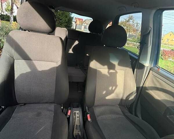 Синий Опель Мерива, объемом двигателя 1.69 л и пробегом 254 тыс. км за 3350 $, фото 20 на Automoto.ua