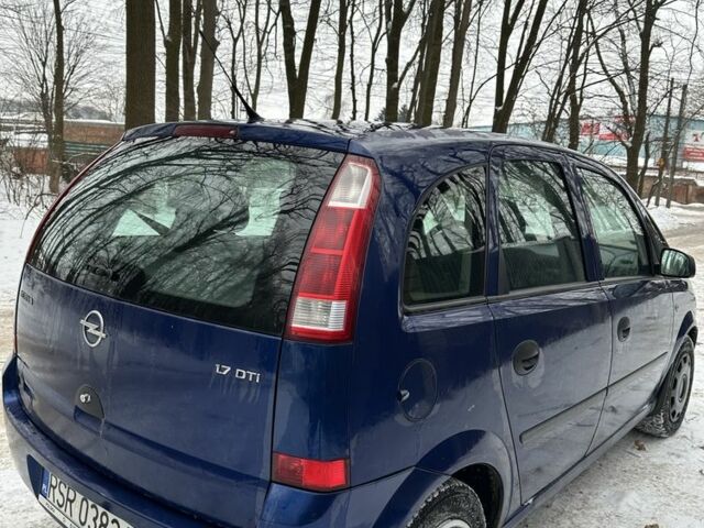 Синий Опель Мерива, объемом двигателя 1.7 л и пробегом 260 тыс. км за 1650 $, фото 3 на Automoto.ua