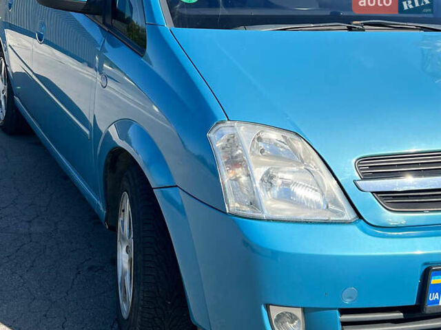 Синий Опель Мерива, объемом двигателя 1.6 л и пробегом 240 тыс. км за 3850 $, фото 4 на Automoto.ua
