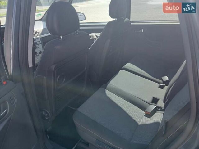 Синий Опель Мерива, объемом двигателя 1.36 л и пробегом 242 тыс. км за 4158 $, фото 2 на Automoto.ua