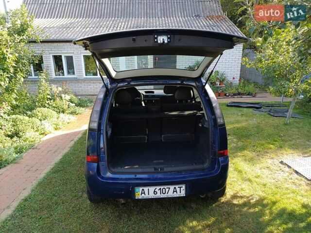 Синий Опель Мерива, объемом двигателя 1.6 л и пробегом 254 тыс. км за 4200 $, фото 4 на Automoto.ua