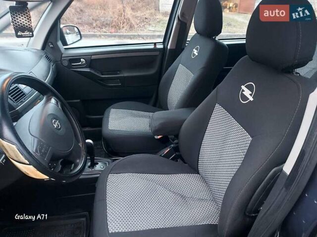 Синий Опель Мерива, объемом двигателя 1.6 л и пробегом 250 тыс. км за 4100 $, фото 19 на Automoto.ua