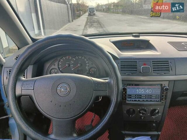 Синий Опель Мерива, объемом двигателя 1.25 л и пробегом 255 тыс. км за 4100 $, фото 3 на Automoto.ua