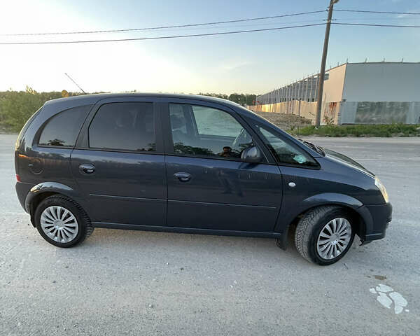 Синий Опель Мерива, объемом двигателя 1.69 л и пробегом 262 тыс. км за 3550 $, фото 9 на Automoto.ua