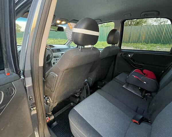 Синий Опель Мерива, объемом двигателя 1.69 л и пробегом 262 тыс. км за 3550 $, фото 18 на Automoto.ua