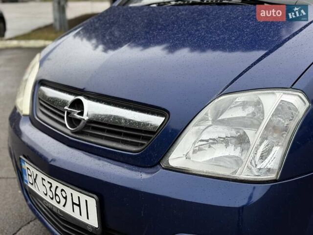 Синий Опель Мерива, объемом двигателя 1.6 л и пробегом 142 тыс. км за 3950 $, фото 5 на Automoto.ua