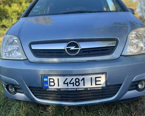 Синий Опель Мерива, объемом двигателя 1.6 л и пробегом 163 тыс. км за 4900 $, фото 4 на Automoto.ua