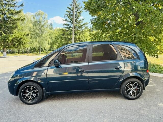 Зеленый Опель Мерива, объемом двигателя 1.6 л и пробегом 107 тыс. км за 4500 $, фото 1 на Automoto.ua