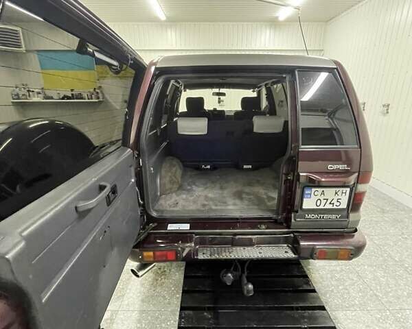 Червоний Опель Монтерей, об'ємом двигуна 3.1 л та пробігом 250 тис. км за 9000 $, фото 17 на Automoto.ua