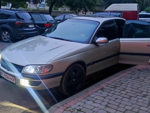 Бежевий Опель Омега, об'ємом двигуна 2 л та пробігом 362 тис. км за 2450 $, фото 6 на Automoto.ua