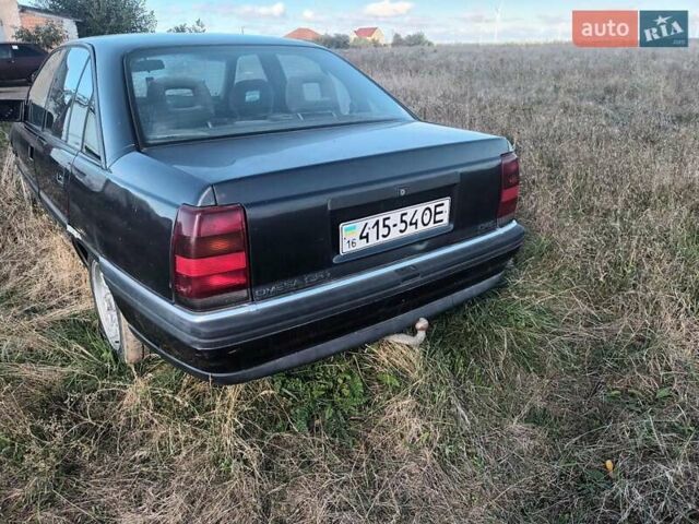 Черный Опель Омега, объемом двигателя 2.6 л и пробегом 250 тыс. км за 471 $, фото 3 на Automoto.ua