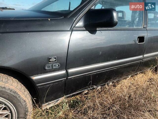 Черный Опель Омега, объемом двигателя 2.6 л и пробегом 250 тыс. км за 471 $, фото 1 на Automoto.ua