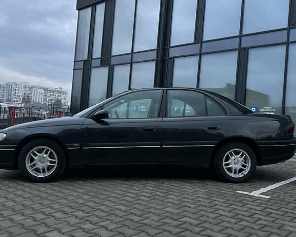 Черный Опель Омега, объемом двигателя 2.5 л и пробегом 300 тыс. км за 2200 $, фото 7 на Automoto.ua