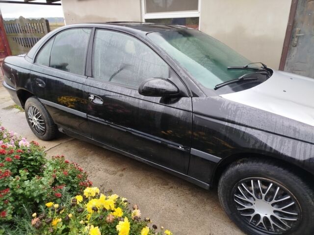 Чорний Опель Омега, об'ємом двигуна 2 л та пробігом 300 тис. км за 950 $, фото 1 на Automoto.ua