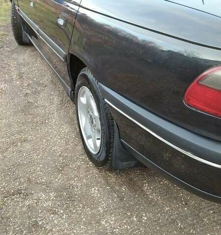 Черный Опель Омега, объемом двигателя 2.5 л и пробегом 300 тыс. км за 2900 $, фото 2 на Automoto.ua