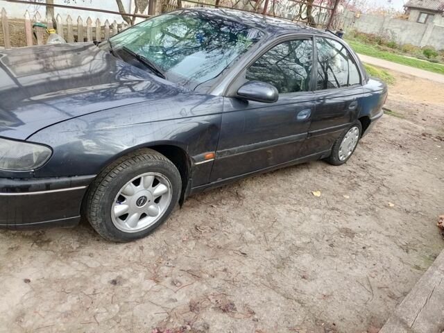 Черный Опель Омега, объемом двигателя 2.5 л и пробегом 361 тыс. км за 1200 $, фото 1 на Automoto.ua