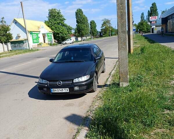 Черный Опель Омега, объемом двигателя 2.5 л и пробегом 150 тыс. км за 2500 $, фото 6 на Automoto.ua