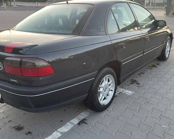 Чорний Опель Омега, об'ємом двигуна 2.5 л та пробігом 311 тис. км за 1950 $, фото 3 на Automoto.ua