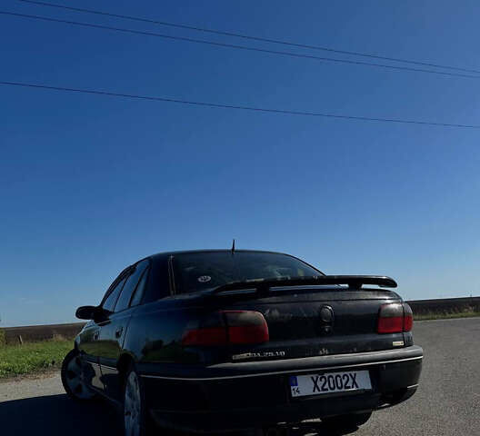 Черный Опель Омега, объемом двигателя 2.5 л и пробегом 470 тыс. км за 1200 $, фото 5 на Automoto.ua