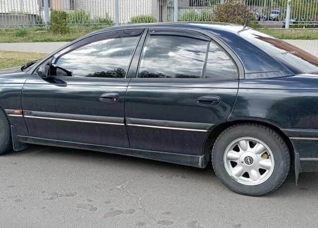 Черный Опель Омега, объемом двигателя 2.5 л и пробегом 311 тыс. км за 2299 $, фото 2 на Automoto.ua