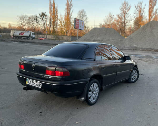 Черный Опель Омега, объемом двигателя 2 л и пробегом 393 тыс. км за 2800 $, фото 4 на Automoto.ua