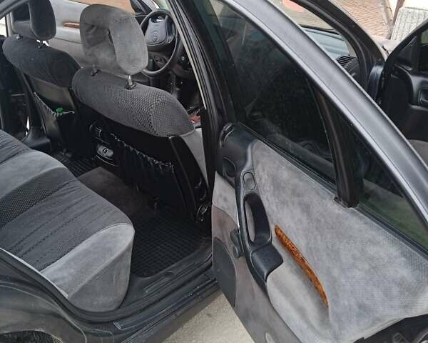 Черный Опель Омега, объемом двигателя 2.5 л и пробегом 328 тыс. км за 3000 $, фото 9 на Automoto.ua