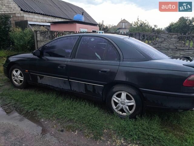 Черный Опель Омега, объемом двигателя 2.5 л и пробегом 500 тыс. км за 800 $, фото 2 на Automoto.ua