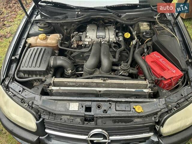 Черный Опель Омега, объемом двигателя 2.5 л и пробегом 274 тыс. км за 2000 $, фото 11 на Automoto.ua