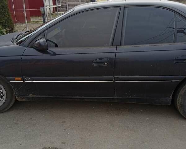 Черный Опель Омега, объемом двигателя 2.5 л и пробегом 328 тыс. км за 3000 $, фото 5 на Automoto.ua