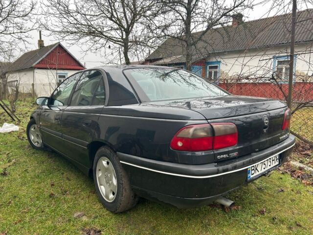 Черный Опель Омега, объемом двигателя 2.5 л и пробегом 274 тыс. км за 2000 $, фото 1 на Automoto.ua